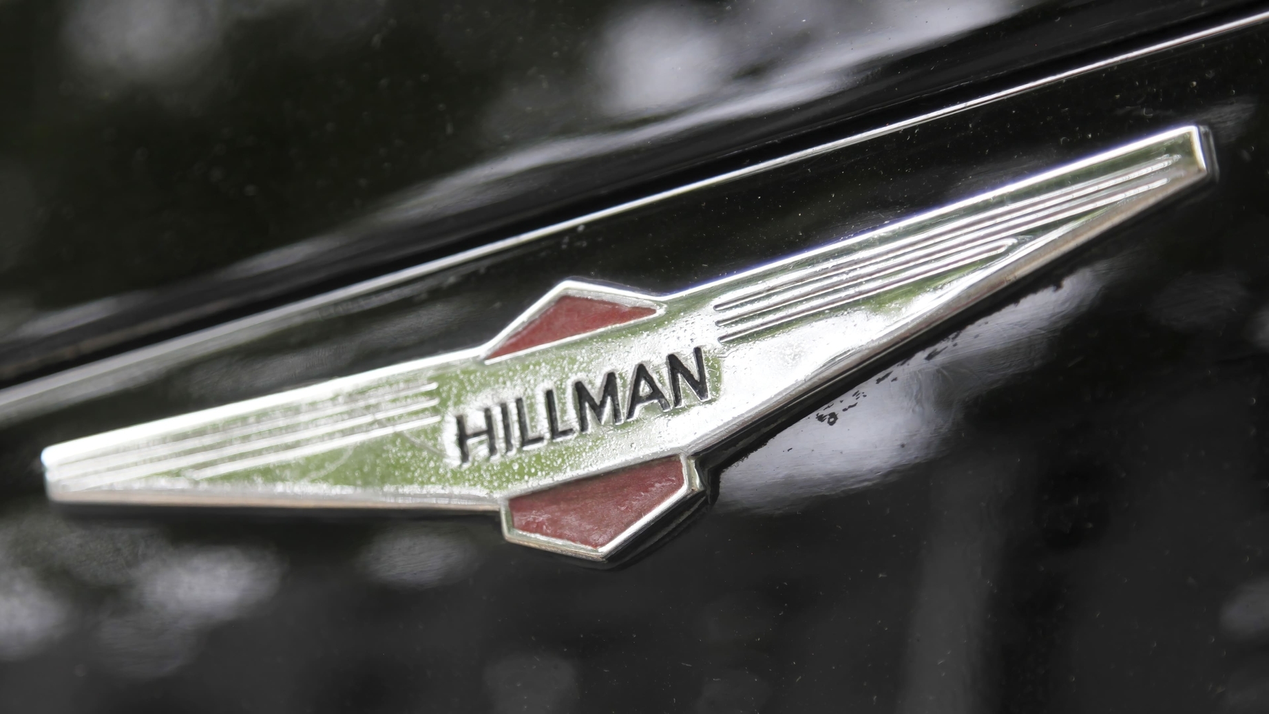 Hillman sign with wings